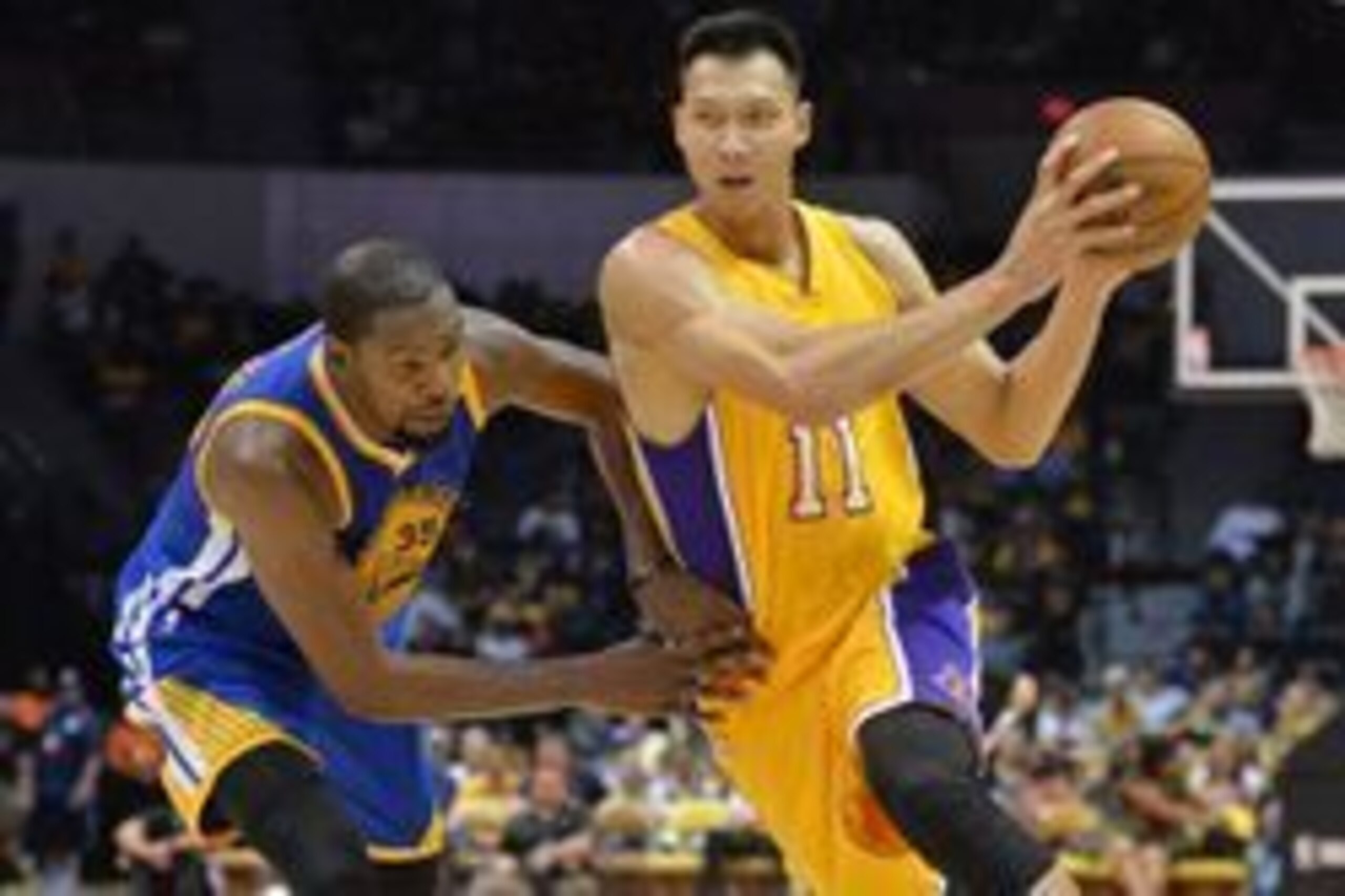 Oct 19, 2016; San Diego, CA, USA; Los Angeles Lakers forward Yi Jianlian (11) is defended by Golden State Warriors forward Kevin Durant (35) during the fourth quarter at Valley View Casino Center. Mandatory Credit: Jake Roth-USA TODAY Sports