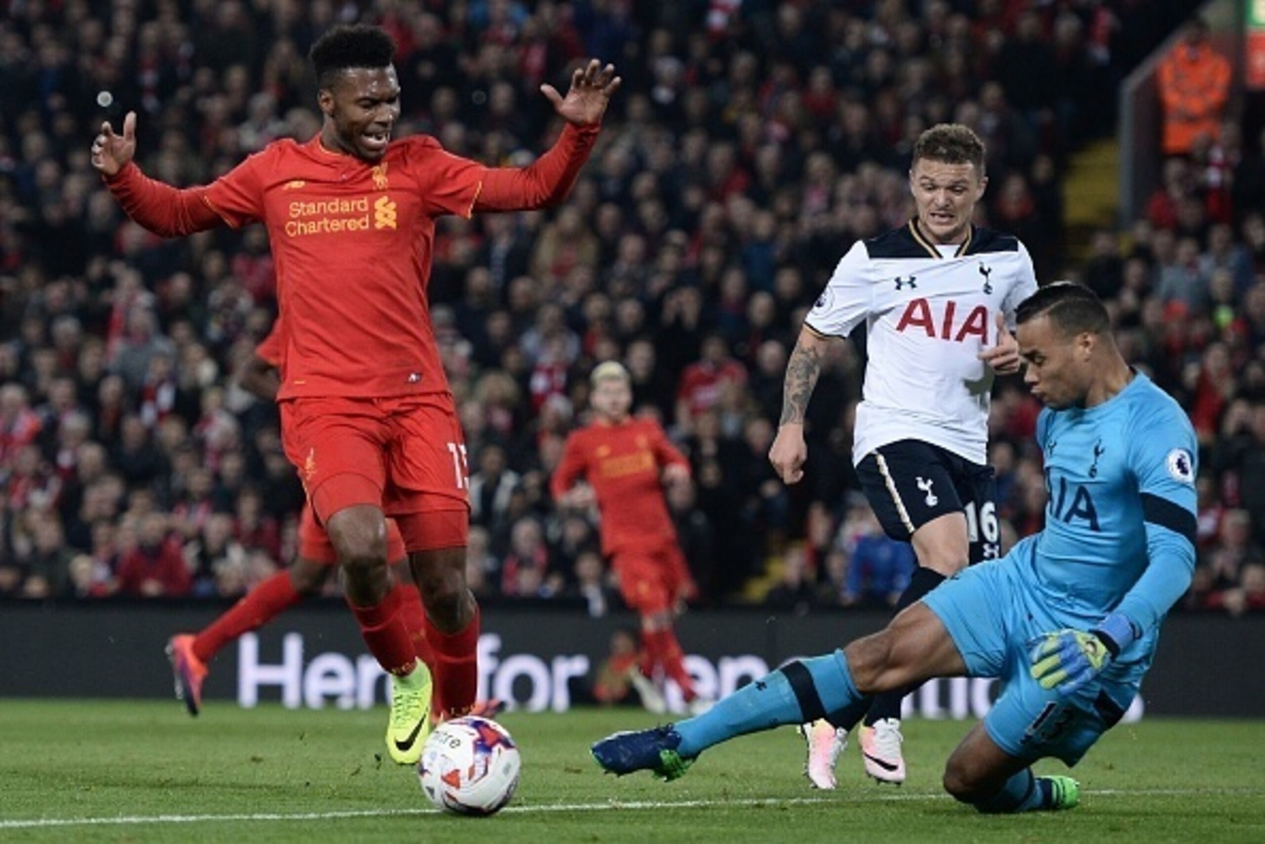 Tottenham Hotspur's Dutch goalkeeper Michel Vorm (R) saves under pressure from Liverpool's English striker Daniel Sturridge during the EFL (English Football League) Cup fourth round match between Liverpool and Tottenham Hotspur at Anfield in Liverpool nor