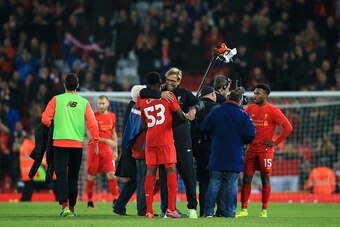 LIVERPOOL, ENGLAND - OCTOBER 25: Oviemuno Ejaria of Liverpool and Jurgen Klopp, Manager of Liverpool embrace after the final whistle during the EFL Cup fourth round match between Liverpool and Tottenham Hotspur at Anfield on October 25, 2016 in Liverpool,