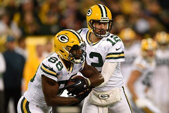 GREENBAY, WI - OCTOBER 20: Quarterback Aaron Rodgers #12 of the Green Bay Packers hands the ball off to teammate wide receiver Ty Montgomery #88 against the Chicago Bears in the first quarter at Lambeau Field on October 20, 2016 in Green Bay, Wisconsin. (