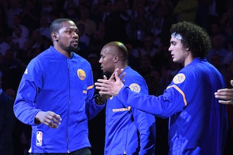 October 25, 2016; Oakland, CA, USA; Golden State Warriors forward Kevin Durant (left) high fives forward David West (center), and center Anderson Varejao (right) before the game against the San Antonio Spurs at Oracle Arena. Mandatory Credit: Kyle Terada-