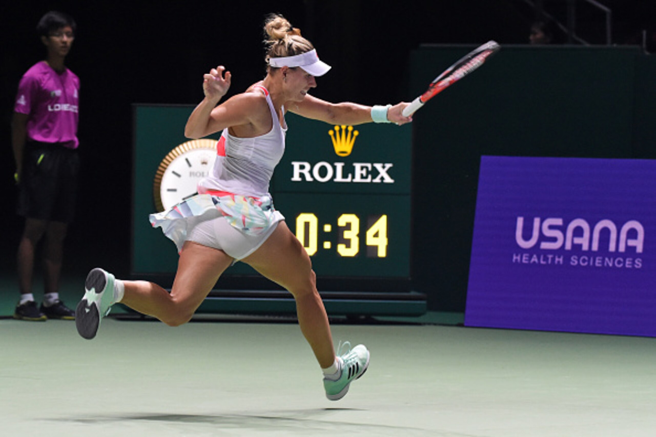 German's Angelique Kerber plays against Romania's Simona Halep in their women's singles match during the WTA finals tennis tournament in Singapore on October 25, 2016. / AFP / ROSLAN RAHMAN        (Photo credit should read ROSLAN RAHMAN/AFP/Getty Images)