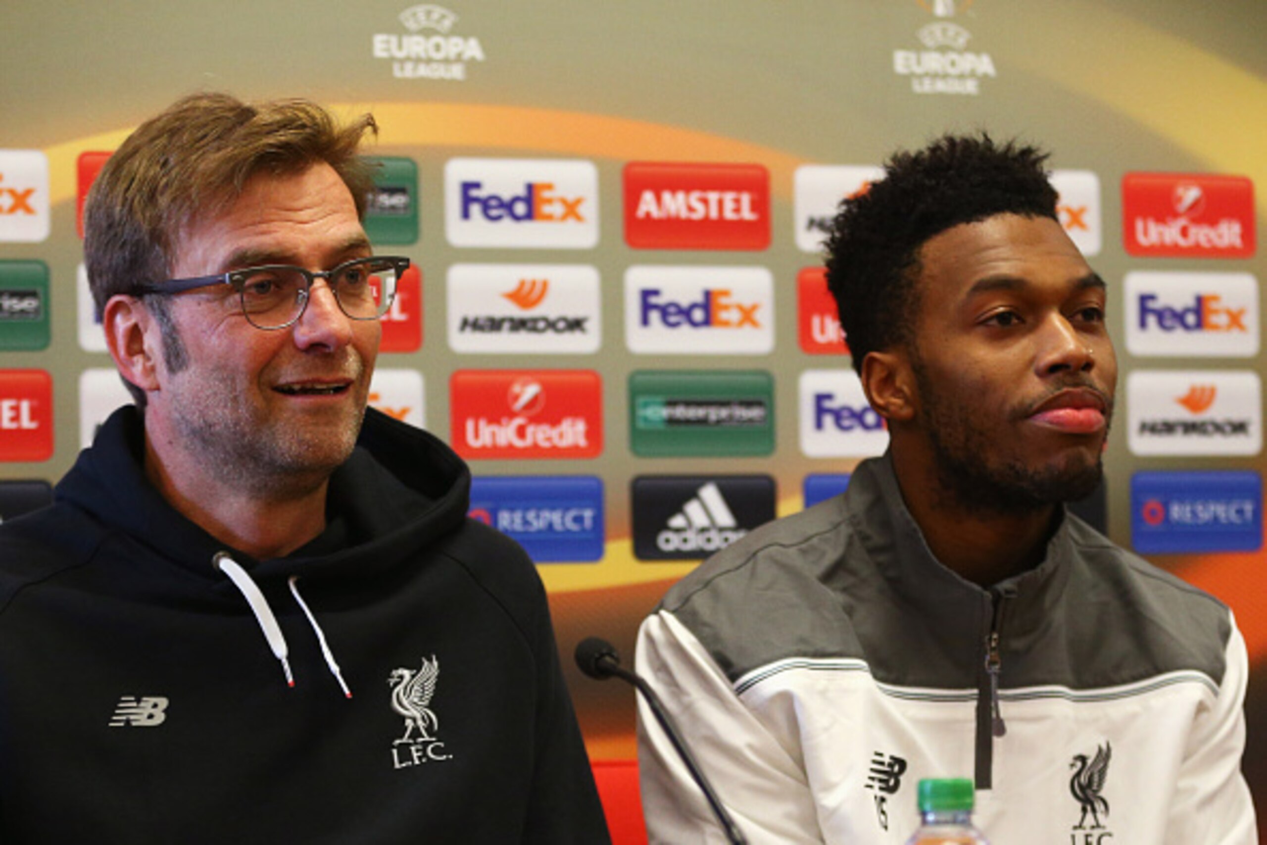 LIVERPOOL, ENGLAND - FEBRUARY 24: Jurgen Klopp manager of Liverpool and Daniel Sturridge look on during a Liverpool press conference ahead of their UEFA Europa League round of 32 second leg match against FC Augsburg at Melwood Training Ground on February LIVERPOOL, ENGLAND - FEBRUARY 24: Jurgen Klopp manager of Liverpool and Daniel Sturridge look on during a Liverpool press conference ahead of their UEFA Europa League round of 32 second leg match against FC Augsburg at Melwood Training Ground on February