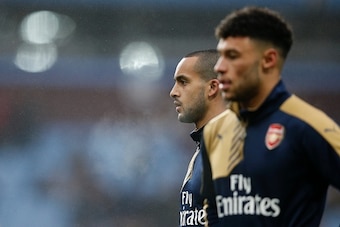 Arsenal's English midfielder Theo Walcott (L) and Arsenal's English midfielder Alex Oxlade-Chamberlain warm up ahead of the English Premier League football match between Aston Villa and Arsenal at Villa Park in Birmingham, central England on December 13, 