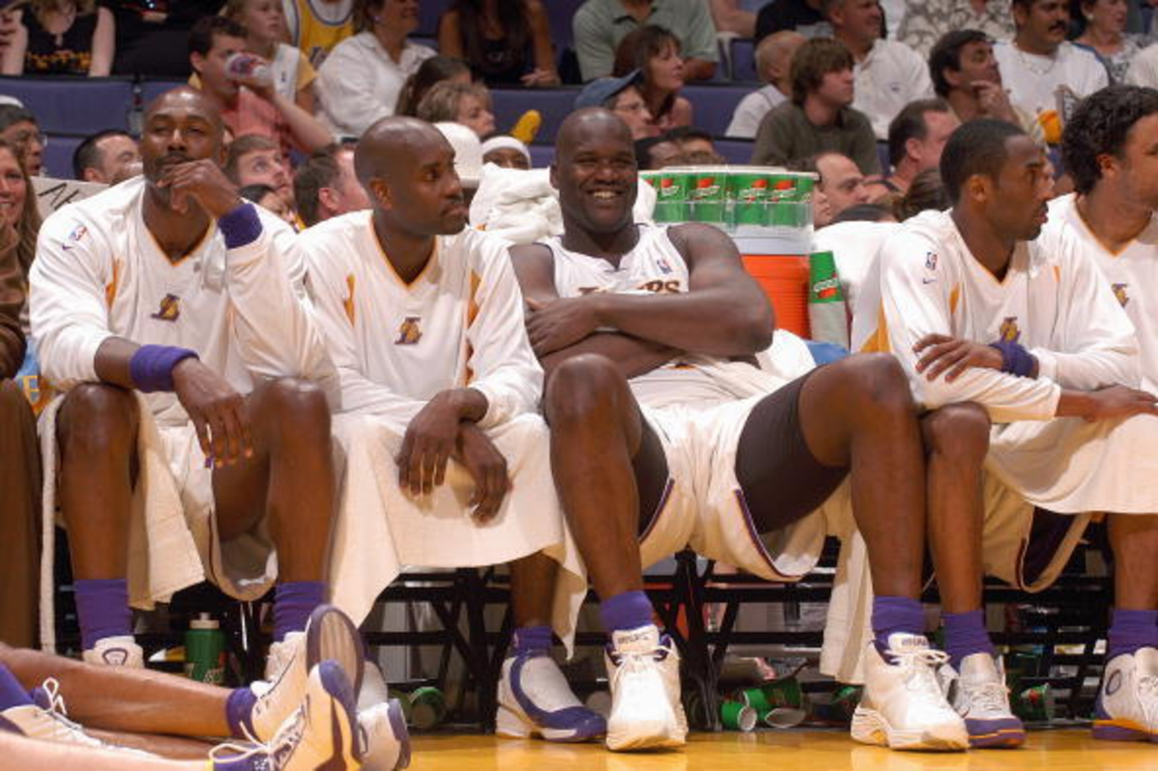 LOS ANGELES - MAY 9:  (L-R) Karl Malone #11, Gary Payton #20, Shaquille O'Neal #34 and Kobe Bryant #8 of the Los Angeles Lakers sit on the bench in Game three of the Western Conference Semifinals during the 2004 NBA Playoffs against the San Antonio Spurs