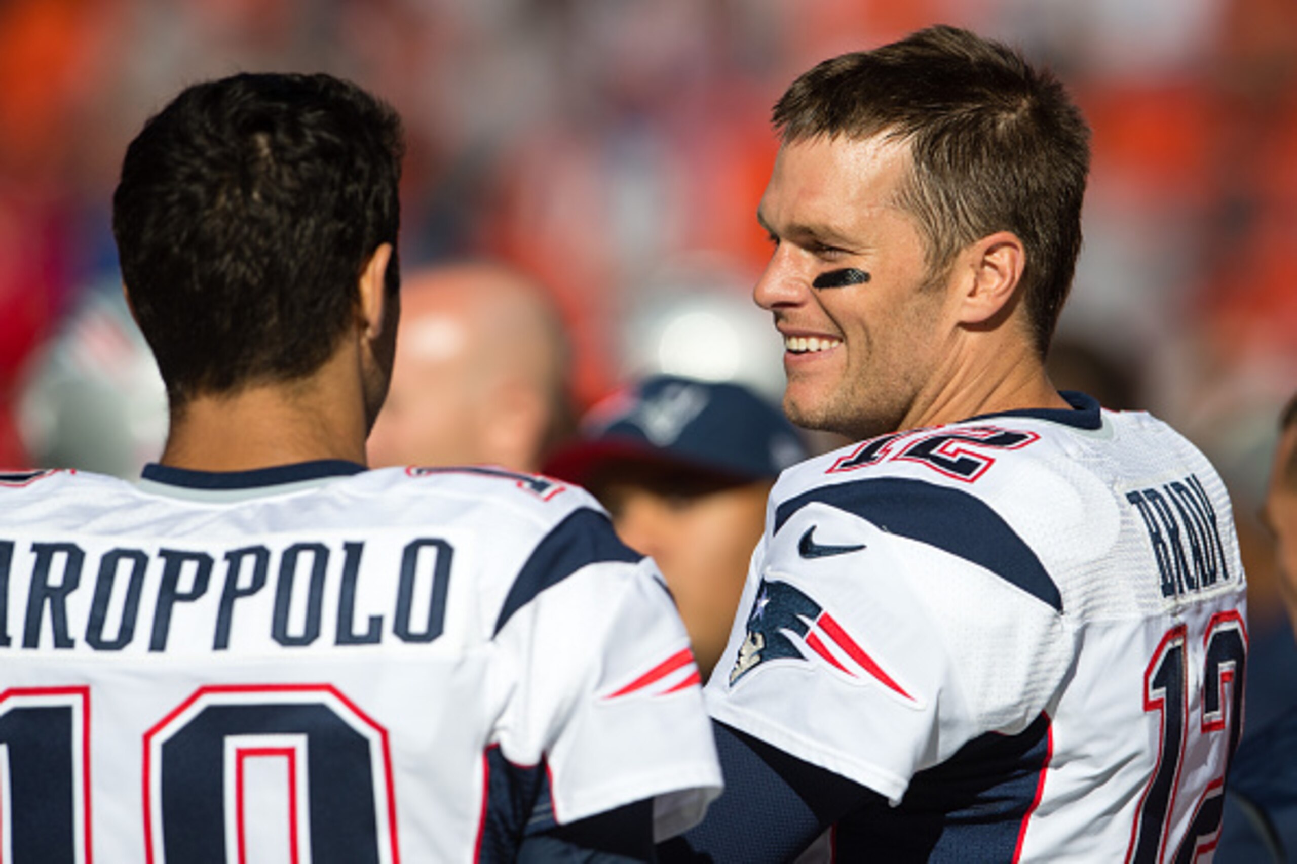 CLEVELAND, OH - OCTOBER 9: Quarterbacks Jimmy Garoppolo #10 and Tom Brady #12 of the New England Patriots talk on the sidelines during the final minutes of the second half against the Cleveland Browns at FirstEnergy Stadium on October 9, 2016 in Cleveland