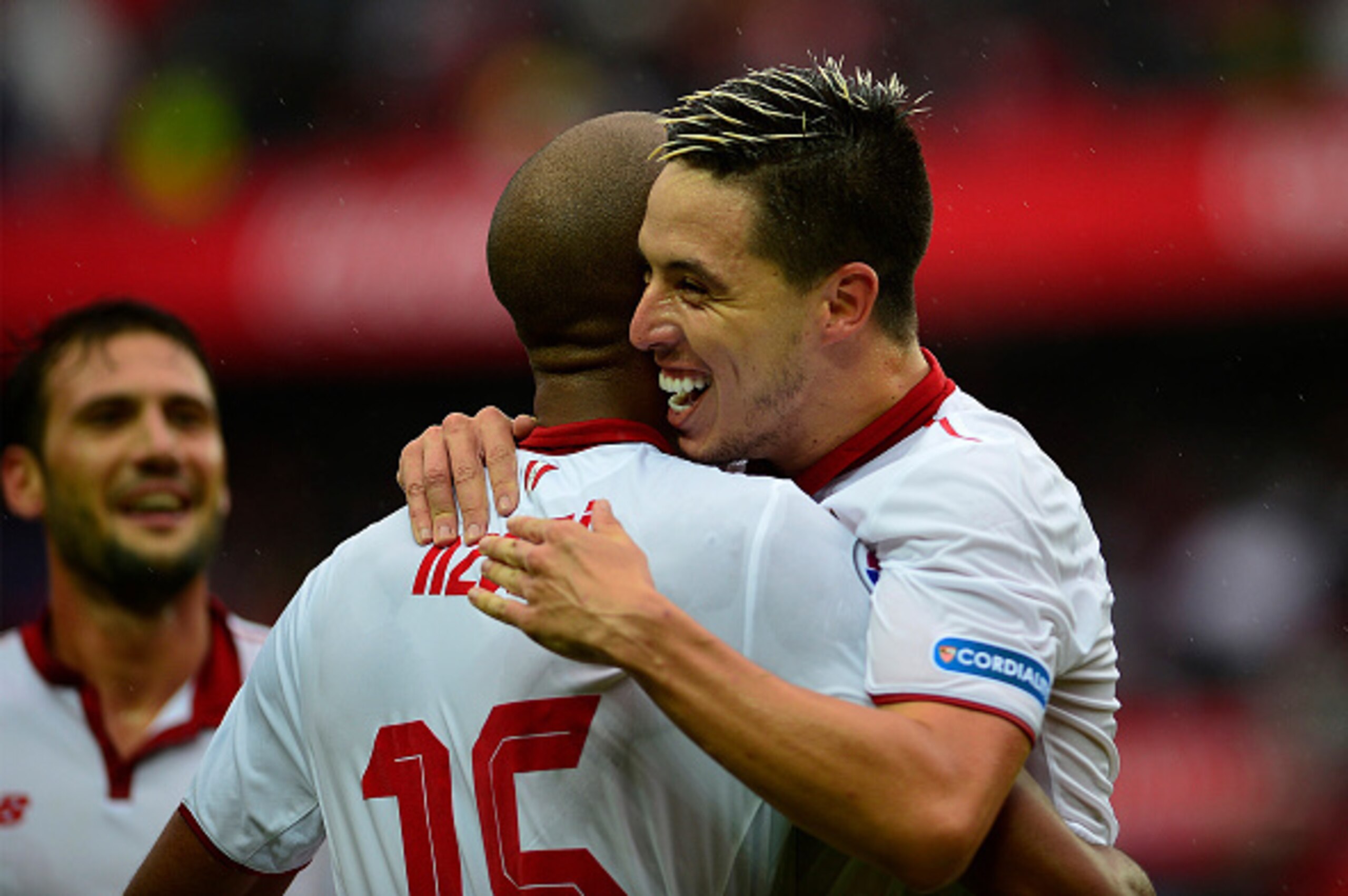 Sevilla's French midfielder Steven N'Zonzi (back) celebrates a goal with Sevilla's French midfielder Samir Nasri (R) during the Spanish league football match between Sevilla FC and Club Atletico de Madrid at the Ramon Sanchez Pizjuan stadium in Sevilla on