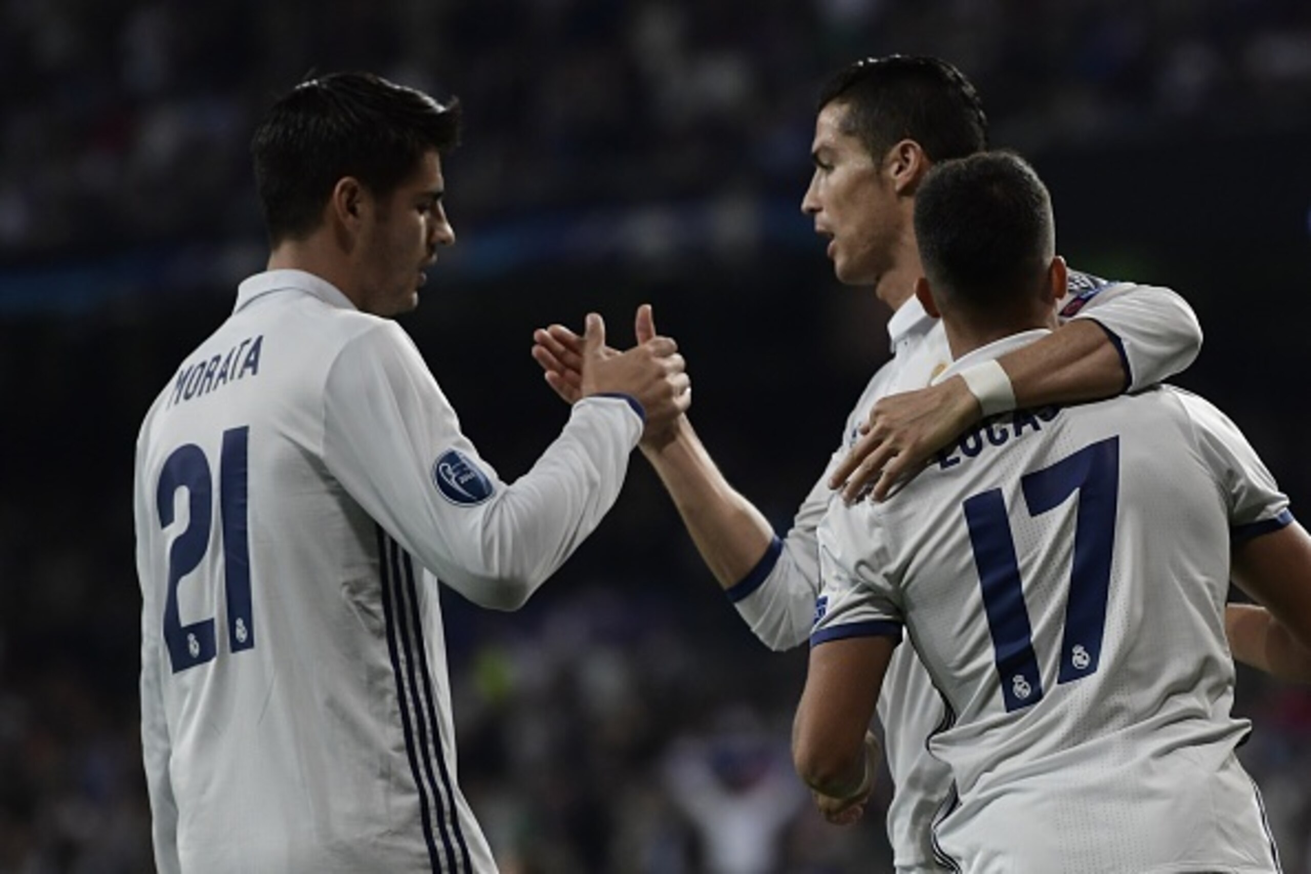 Real Madrid's midfielder Lucas Vazquez (R), Real Madrid's forward Alvaro Morata (L) and Real Madrid's Portuguese forward Cristiano Ronaldo celebrate after scoring a goal during the UEFA Champions League football match Real Madrid CF vs Legia  Legia Warsza