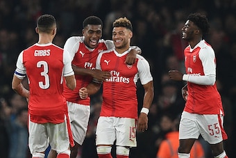 Arsenal's English midfielder Alex Oxlade-Chamberlain (2nd R) celebrates with teammates after scoring their second goal during the EFL (English Football League) Cup fourth round match between Arsenal and Reading at The Emirates Stadium in London on October