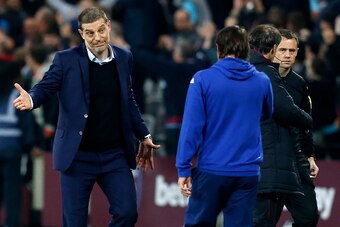 West Ham United's Croatian manager Slaven Bilic (L) gestures to Chelsea's Italian head coach Antonio Conte after the EFL (English Football League) Cup fourth round match between West Ham United and Chelsea at The London Stadium in east London on October 2