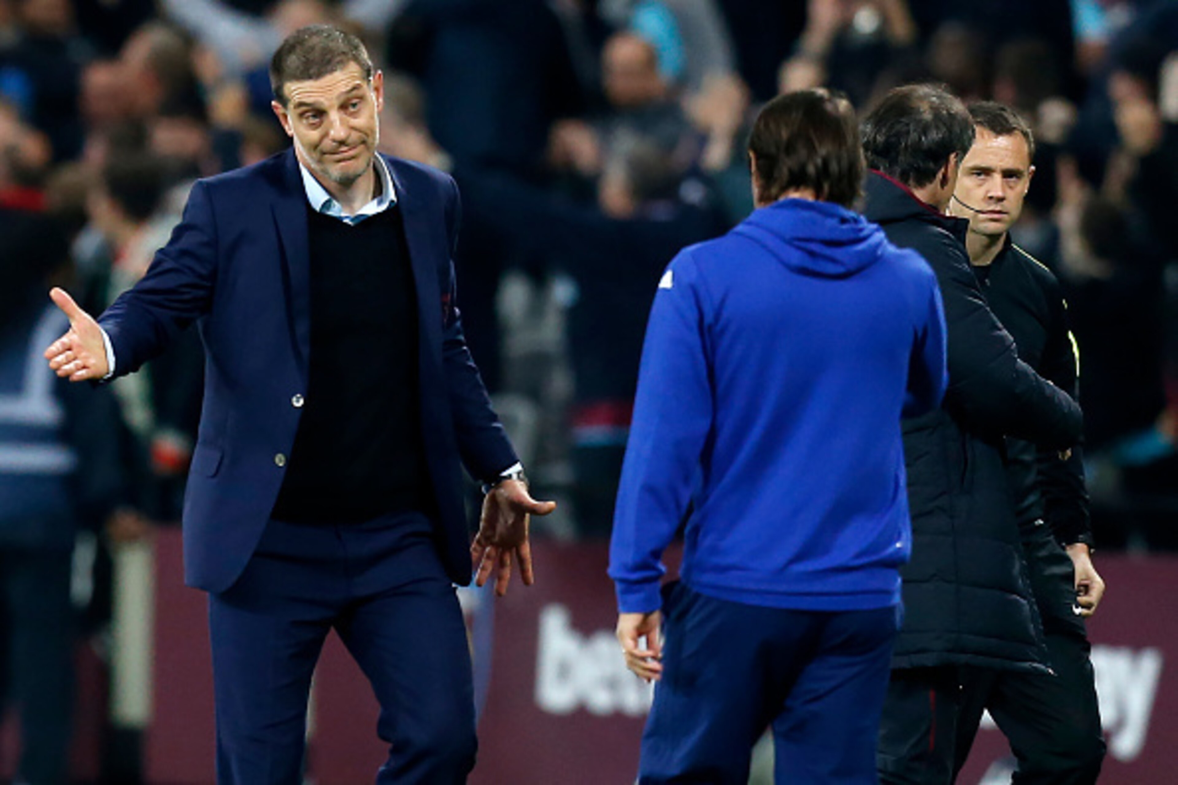 West Ham United's Croatian manager Slaven Bilic (L) gestures to Chelsea's Italian head coach Antonio Conte after the EFL (English Football League) Cup fourth round match between West Ham United and Chelsea at The London Stadium in east London on October 2 West Ham United's Croatian manager Slaven Bilic (L) gestures to Chelsea's Italian head coach Antonio Conte after the EFL (English Football League) Cup fourth round match between West Ham United and Chelsea at The London Stadium in east London on October 2