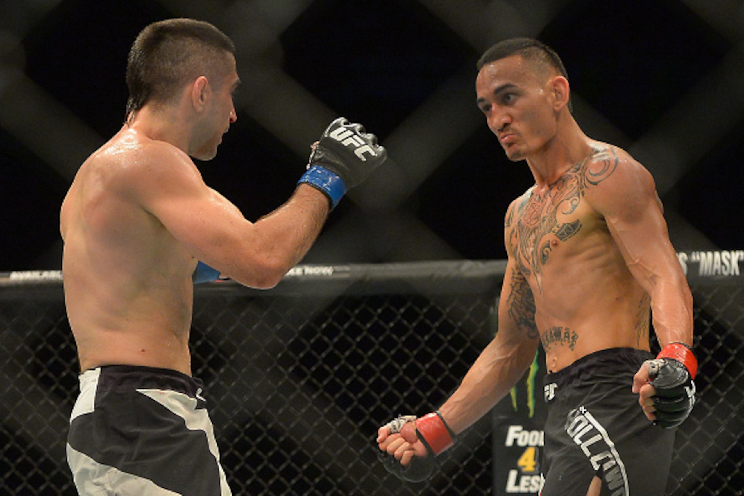 INGLEWOOD, CA - JUNE 04: Ricardo Lamas (blue gloves) and Max Holloway (red gloves) during their featherweight bout at UFC 199 at The Forum on June 4, 2016 in Inglewood, California. (Photo by Jayne Kamin-Oncea/Getty Images) INGLEWOOD, CA - JUNE 04: Ricardo Lamas (blue gloves) and Max Holloway (red gloves) during their featherweight bout at UFC 199 at The Forum on June 4, 2016 in Inglewood, California. (Photo by Jayne Kamin-Oncea/Getty Images)