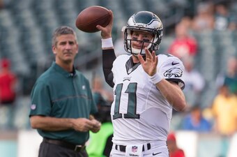 PHILADELPHIA, PA - AUGUST 11: Carson Wentz #11 of the Philadelphia Eagles warms up as offensive coordinator Frank Reich looks on prior to the game against the Tampa Bay Buccaneers at Lincoln Financial Field on August 11, 2016 in Philadelphia, Pennsylvania