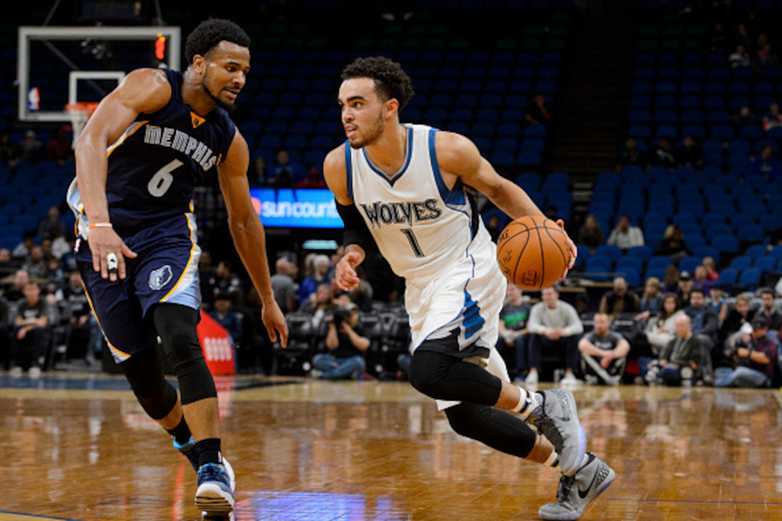 MINNEAPOLIS, MN - OCTOBER 19: Tyus Jones #1 of the Minnesota Timberwolves drives to the basket against Chris Crawford #6 of the Memphis Grizzlies during the preseason game on October 19, 2016 at Target Center in Minneapolis, Minnesota. NOTE TO USER: User 