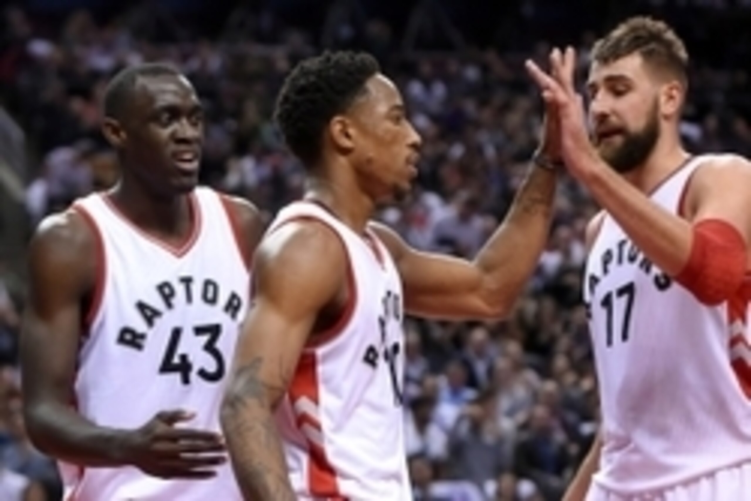 Oct 26, 2016; Toronto, Ontario, CAN;  Toronto Raptors guard DeMar DeRozan (10) is greeted by center Jonas Valanciunas (17) and forward Pascal Siakam (43) after making a basket against Detroit Pistons in the second half at Air Canada Centre. Mandatory Cred