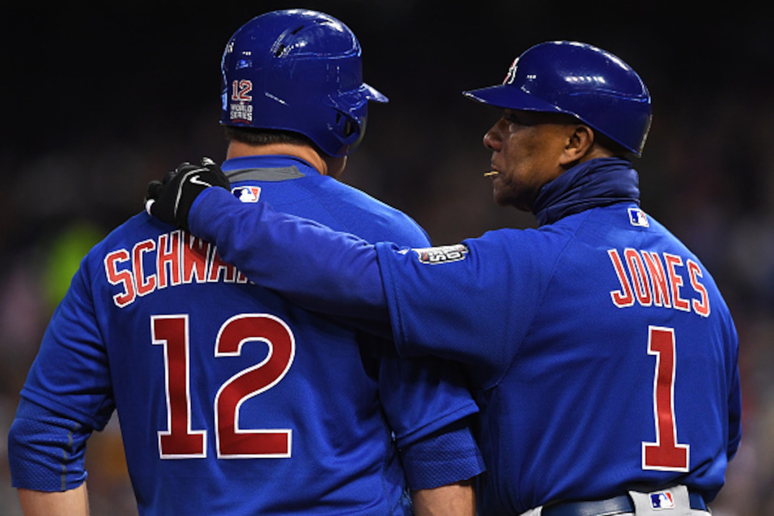 CLEVELAND, OH - OCTOBER 26:  Kyle Schwarber #12 of the Chicago Cubs talks with third base coach Gary Jones #1 against the Cleveland Indians in Game Two of the 2016 World Series at Progressive Field on October 26, 2016 in Cleveland, Ohio.  (Photo by Jason 