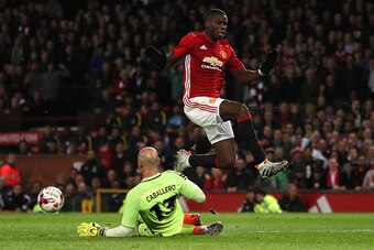 MANCHESTER, ENGLAND - OCTOBER 26:  Willy Caballero of Manchester City thwarts the attempt on goal of Paul Pogba of Manchester United during the EFL Cup Fourth Round match between Manchester United and Manchester City at Old Trafford on October 26, 2016 in