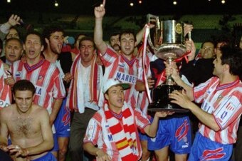 Atletico celebrate their Copa del Rey triumph, with Simeone far left.