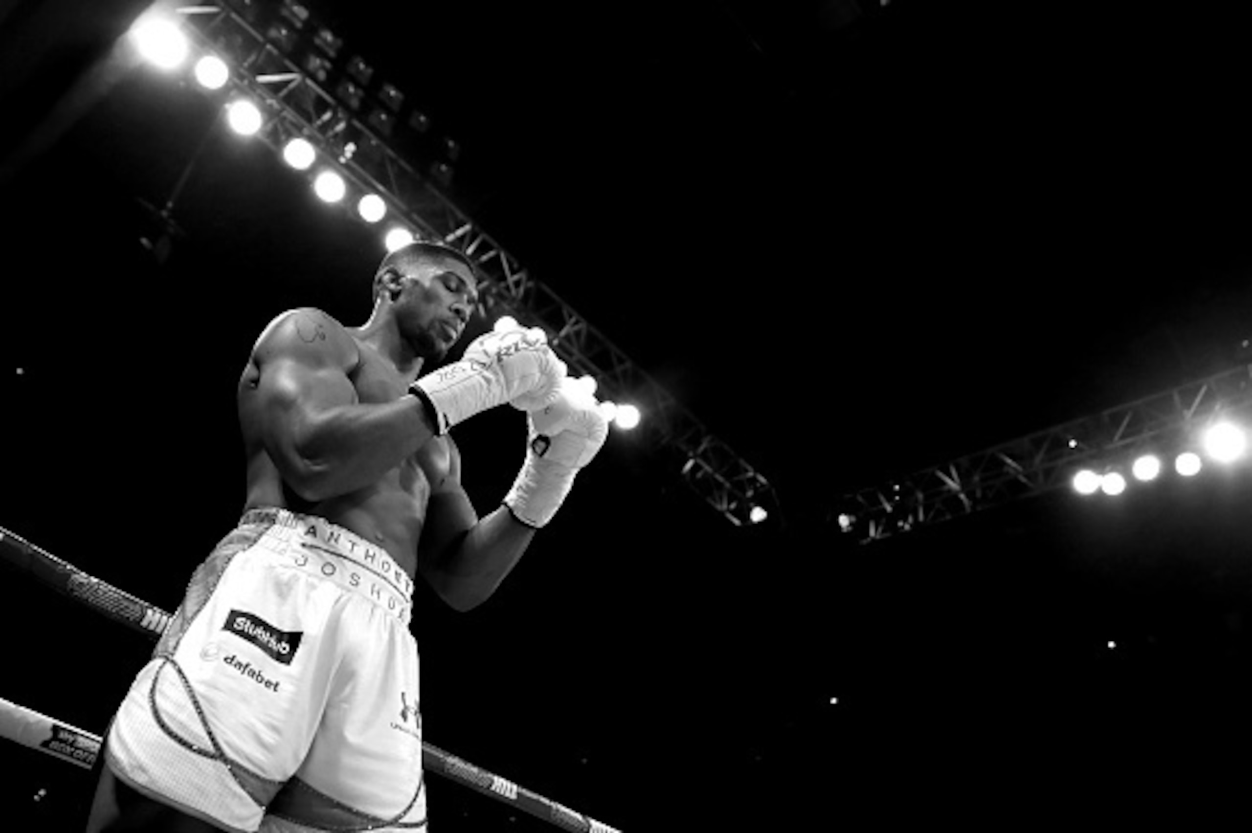 LONDON, ENGLAND - JUNE 25: (EDITORS NOTE: THIS IMAGE HAS BEEN CONVERTED TO BLACK & WHITE) Anthony Joshua of Great Britain prepares to face Dominic Breazeale of The USA during their IBF World Heavyweight Championship bout at The O2 Arena on June 25, 2016 LONDON, ENGLAND - JUNE 25: (EDITORS NOTE: THIS IMAGE HAS BEEN CONVERTED TO BLACK & WHITE) Anthony Joshua of Great Britain prepares to face Dominic Breazeale of The USA during their IBF World Heavyweight Championship bout at The O2 Arena on June 25, 2016
