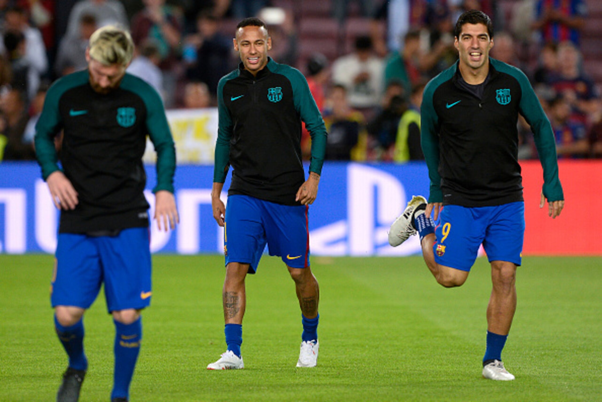 Barcelona's Argentinian forward Lionel Messi (L), Barcelona's Uruguayan forward Luis Suarez (R) and Barcelona's Brazilian forward Neymar warm up before the UEFA Champions League football match FC Barcelona vs Manchester City at the Camp Nou stadium in Bar Barcelona's Argentinian forward Lionel Messi (L), Barcelona's Uruguayan forward Luis Suarez (R) and Barcelona's Brazilian forward Neymar warm up before the UEFA Champions League football match FC Barcelona vs Manchester City at the Camp Nou stadium in Bar