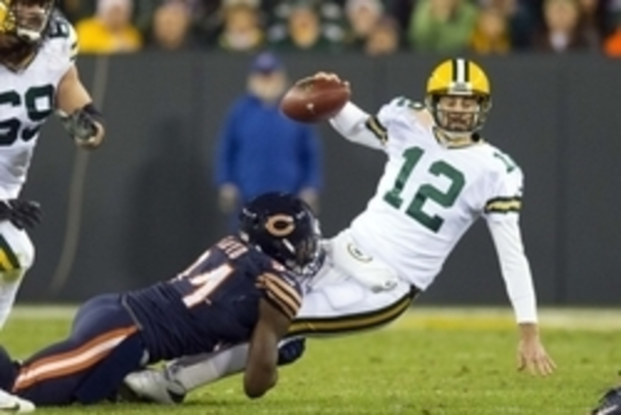 Oct 20, 2016; Green Bay, WI, USA;  Green Bay Packers quarterback Aaron Rodgers (12) is sacked by Chicago Bears linebacker Leonard Floyd (94) during the second quarter at Lambeau Field. Mandatory Credit: Jeff Hanisch-USA TODAY Sports