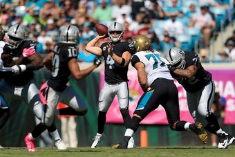 JACKSONVILLE, FL - OCTOBER 23:   Derek Carr #4 of the Oakland Raiders looks to pass against the Jacksonville Jaguars during the game at EverBank Field on October 23, 2016 in Jacksonville, Florida.  (Photo by Rob Foldy/Getty Images)
