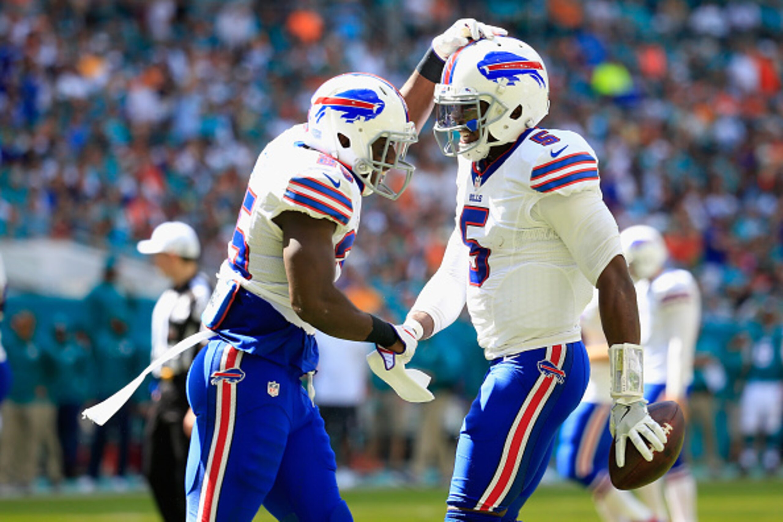 MIAMI GARDENS, FL - OCTOBER 23:  (R)  Tyrod Taylor #5 of the Buffalo Bills is congratulated on scoring a touchdown by his teammate (L)  LeSean McCoy #25 of the Buffalo Bills against the Miami Dolphins at Hard Rock Stadium on October 23, 2016 in Miami Gard