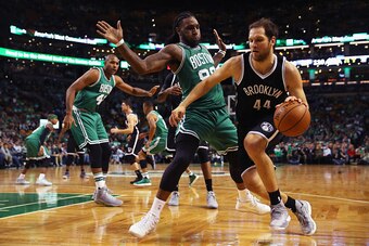 BOSTON, MA - OCTOBER 26:  Bojan Bogdanovic #44 of the Brooklyn Nets drives against Jae Crowder #99 of the Boston Celtics  during the second half at TD Garden on October 26, 2016 in Boston, Massachusetts. The Celtics defeat the Nets 122-117. NOTE TO USER: 