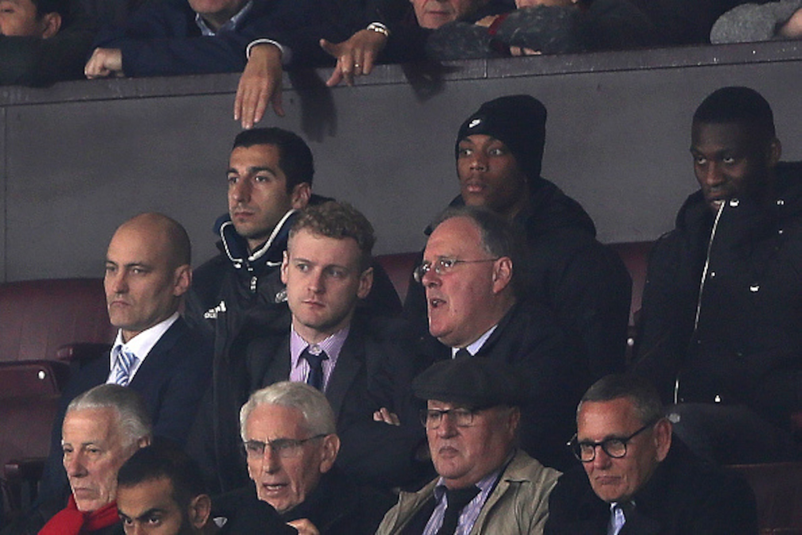 MANCHESTER, ENGLAND - OCTOBER 26:  Henrikh Mkhitaryan (L) of Manchester United watches from the stands with Anthony Martial during the EFL Cup Fourth Round match between Manchester United and Manchester City at Old Trafford on October 26, 2016 in Manchest