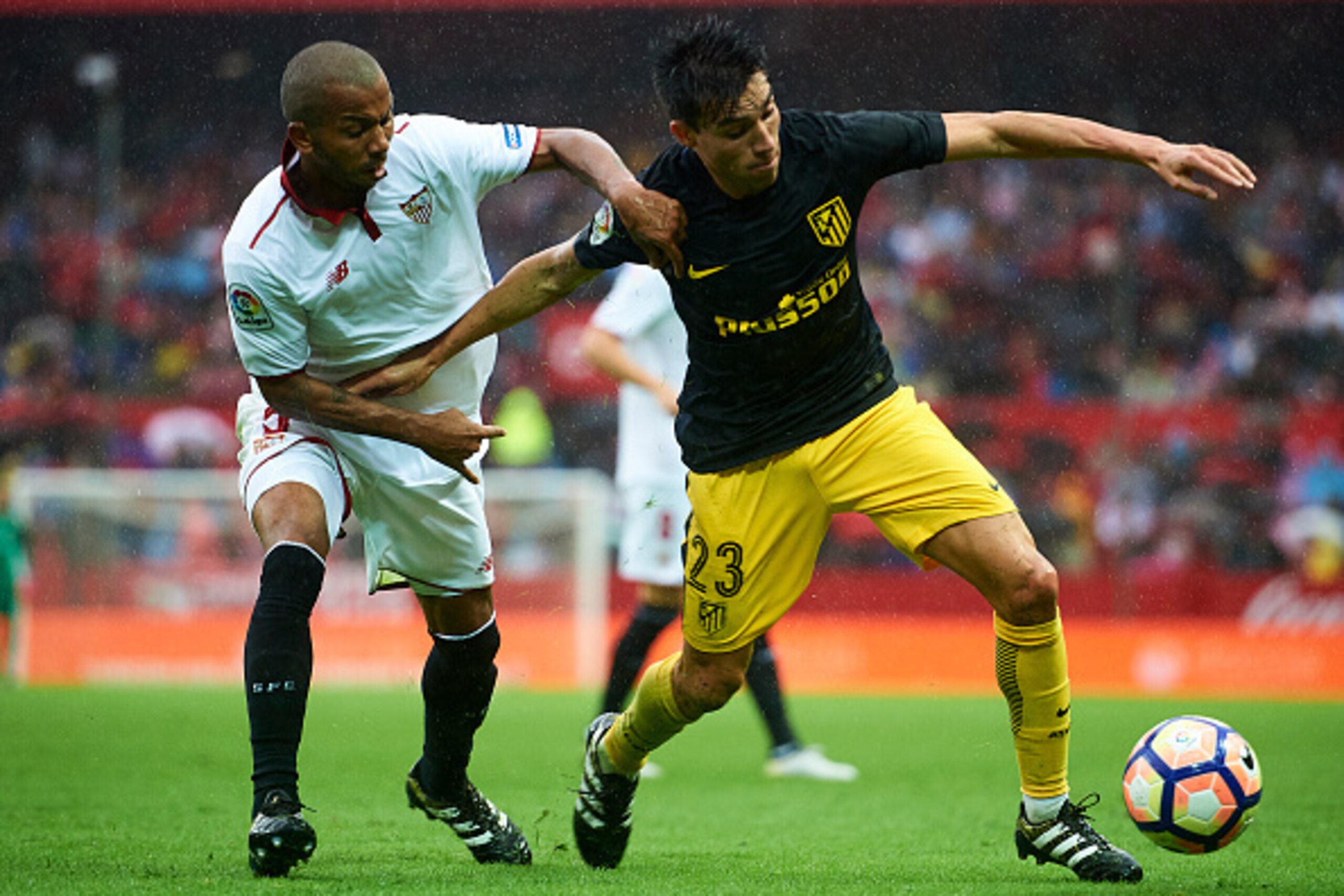 SEVILLE, SPAIN - OCTOBER 23: Nicolas Gaitan of Club Atletico de Madrid (R) competes for the ball with Mariano Ferreira of Sevilla FC (R) during the match between Sevilla FC vs Club Atletico de Madrid as part of La Liga at Estadio Ramon Sanchez Pizjuano SEVILLE, SPAIN - OCTOBER 23: Nicolas Gaitan of Club Atletico de Madrid (R) competes for the ball with Mariano Ferreira of Sevilla FC (R) during the match between Sevilla FC vs Club Atletico de Madrid as part of La Liga at Estadio Ramon Sanchez Pizjuano