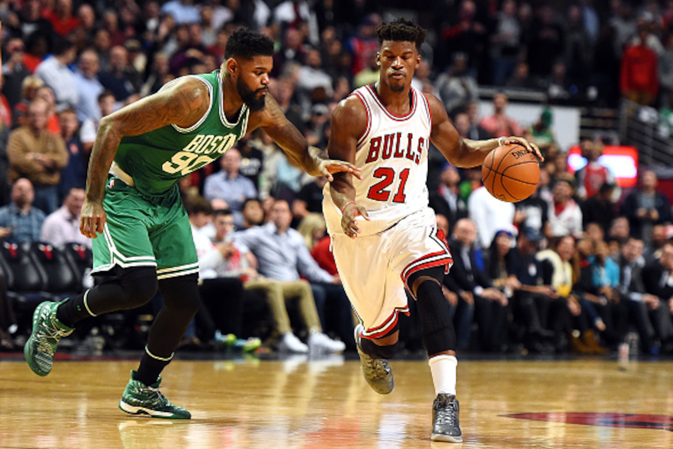 CHICAGO, IL - OCTOBER 27:  Jimmy Butler #21 of the Chicago Bulls drives to the basket against Amir Johnson #90 of the Boston Celtics during the second half of a game at the United Center on October 27, 2016 in Chicago, Illinois. NOTE TO USER: User express