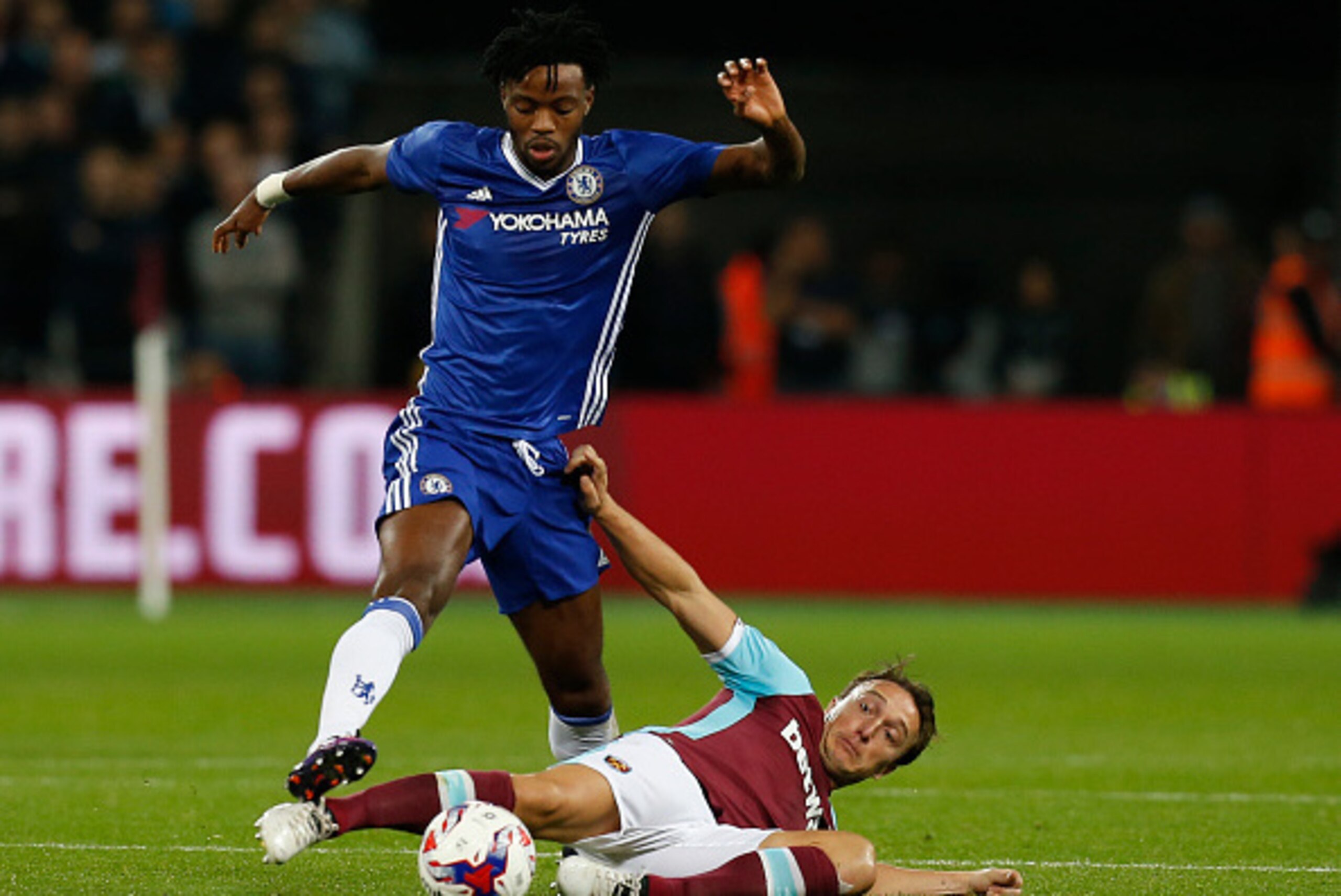 Chelsea's English midfielder  Nathaniel Chalobah (L) vies with West Ham United's English midfielder Mark Noble during the EFL (English Football League) Cup fourth round match between West Ham United and Chelsea at The London Stadium in east London on Octo