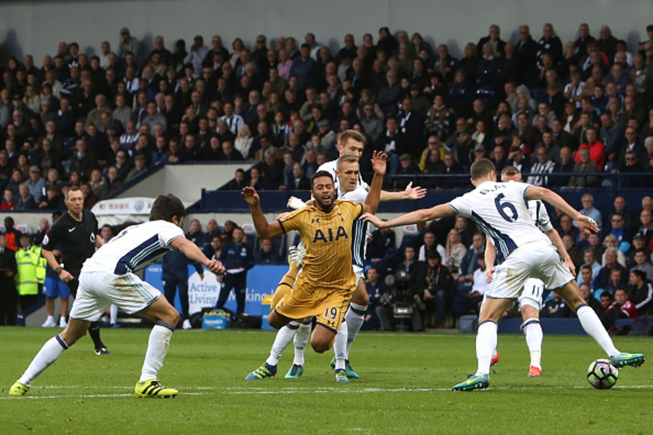 Tottenham Hotspur's Belgian midfielder Mousa Dembele (C) is booked after taking a dive during the English Premier League football match between West Bromwich Albion and Tottenham Hotspur at The Hawthorns stadium in West Bromwich, central England, on Octob Tottenham Hotspur's Belgian midfielder Mousa Dembele (C) is booked after taking a dive during the English Premier League football match between West Bromwich Albion and Tottenham Hotspur at The Hawthorns stadium in West Bromwich, central England, on Octob