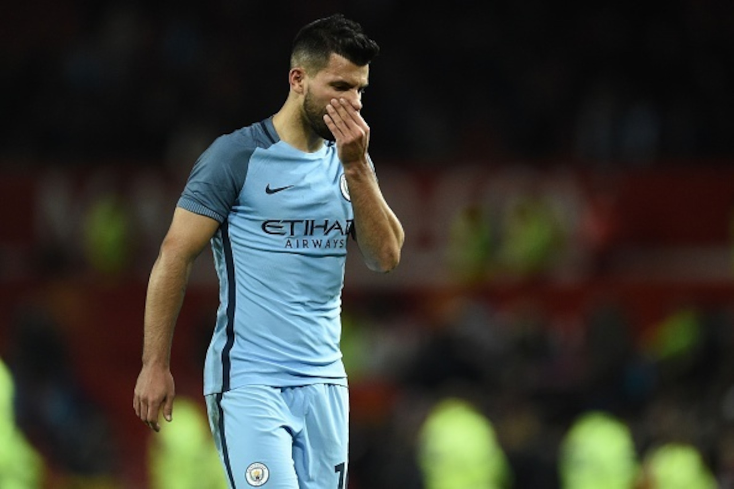 Manchester City's Argentinian striker Sergio Aguero leaves the pitch after the EFL (English Football League) Cup fourth round match between Manchester United and Manchester City at Old Trafford in Manchester, north west England on October 26, 2016.
Manche