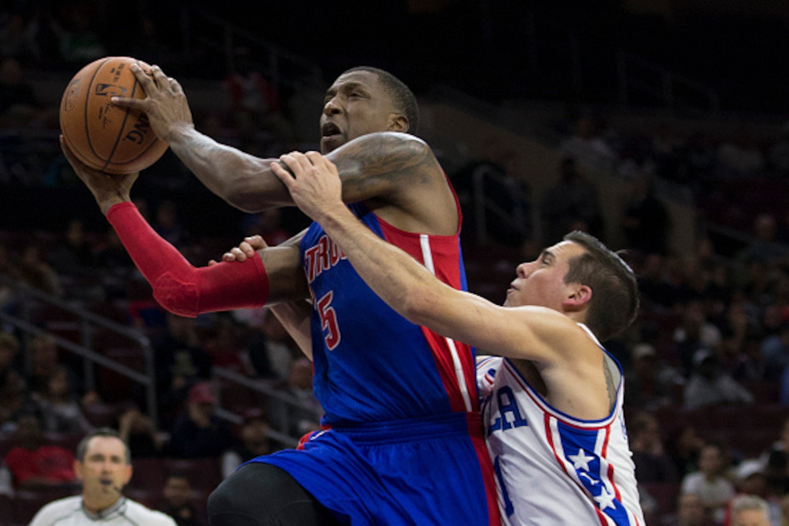PHILADELPHIA, PA - OCTOBER 15: T.J. McConnell #1 of the Philadelphia 76ers fouls Kentavious Caldwell-Pope #5 of the Detroit Pistons in the second half at Wells Fargo Center on October 15, 2016 in Philadelphia, Pennsylvania. The Pistons defeated the 76ers 