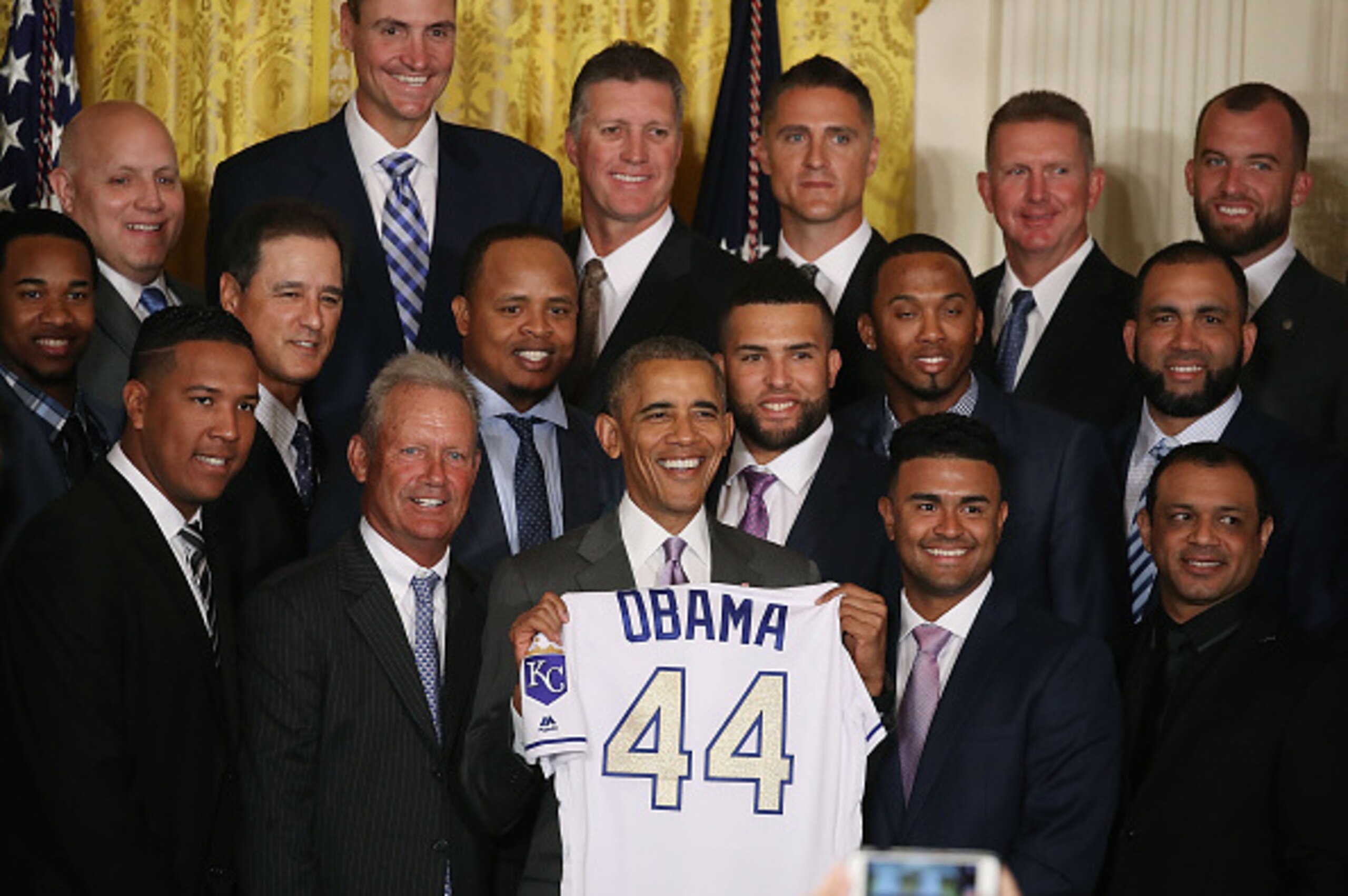 WASHINGTON, DC - JULY 21: U.S. President Barack Obama (C) holds a jersey given to him by the MLB 2015 World Series Champion Kansas City Royals during an event to honor them for their winning season last year at the White House July 21, 2016 in Washington,
