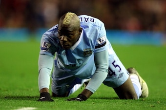 LIVERPOOL, ENGLAND - NOVEMBER 27:  Mario Balotelli of Manchester City looks on during the Barclays Premier League match between Liverpool and Manchester City at Anfield on November 27, 2011 in Liverpool, England.  (Photo by Alex Livesey/Getty Images)