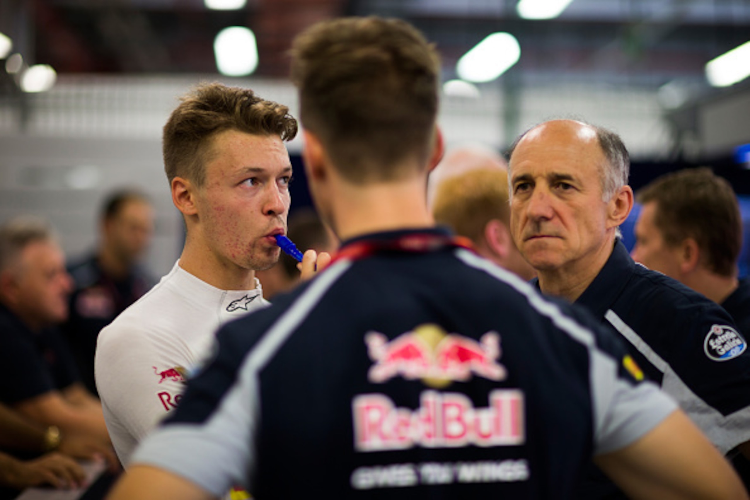 SINGAPORE - SEPTEMBER 16: Daniil Kvyat of Russia and Scuderia Toro Rosso and Scuderia Toro Rosso Team Principal Franz Tost in the garage during practice for the Formula One Grand Prix of Singapore at Marina Bay Street Circuit on September 16, 2016 in Sing