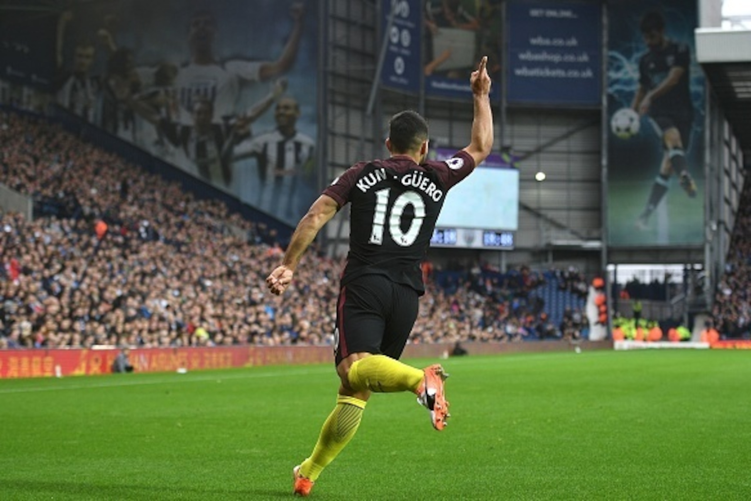 Manchester City's Argentinian striker Sergio Aguero celebrates after scoring the opening goal of the English Premier League football match between West Bromwich Albion and Manchester City at The Hawthorns stadium in West Bromwich, central England, on Octo