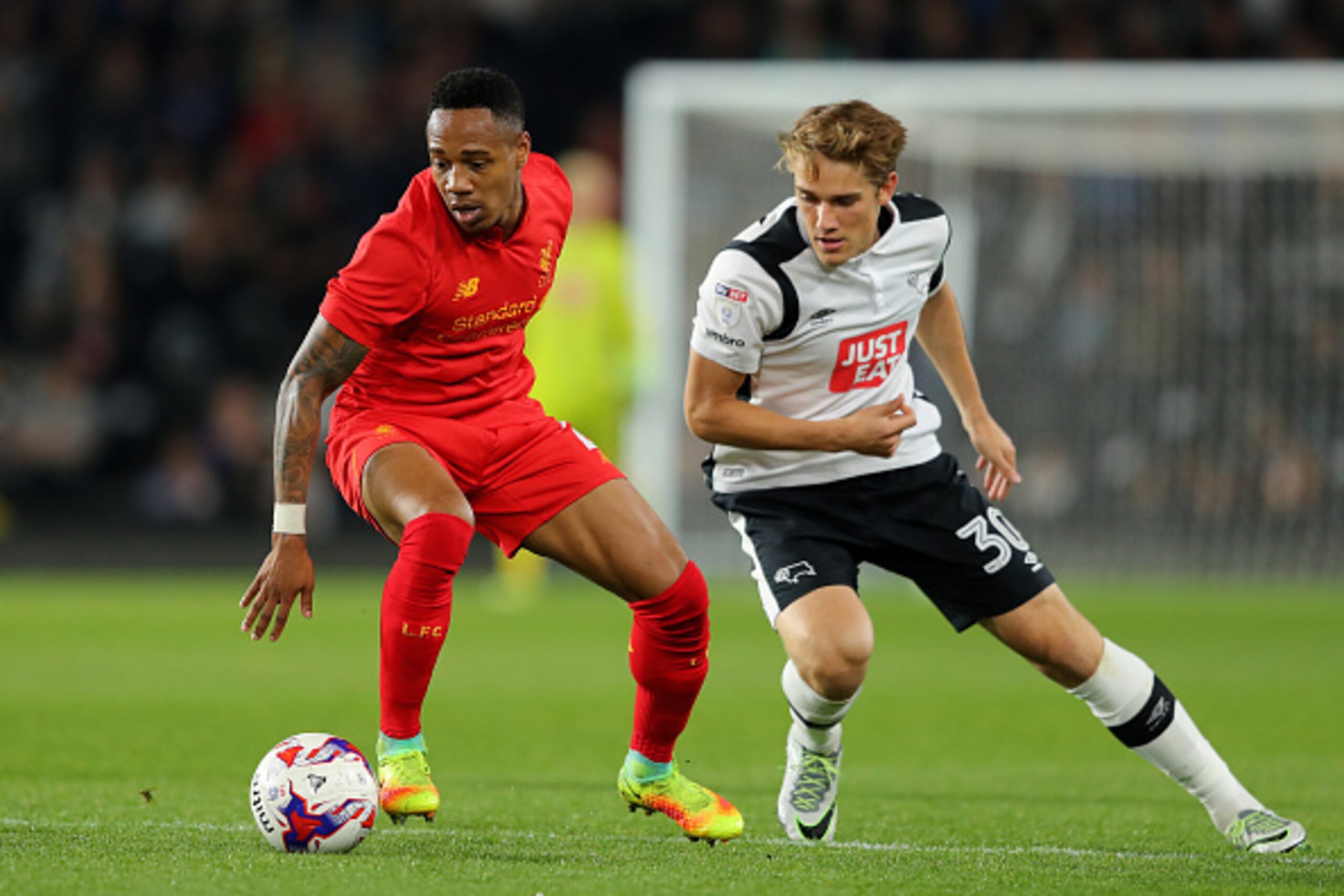 DERBY, ENGLAND - SEPTEMBER 20:  Nathaniel Clyne of Liverpool in action with Timi Elsnik of Derby County  during the EFL Cup Third Round match between Derby County and Liverpool at iPro Stadium on September 20, 2016 in Derby, England.  (Photo by Richard He