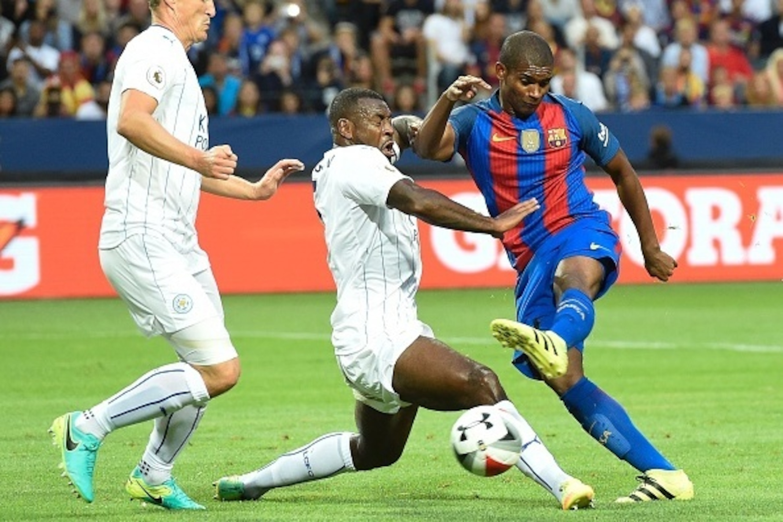 Barcelona's Brazilian defender Marlon Santos (R) vies with Leicester's English defender Danny Simpson (C) during the 2016 International Champions Cup friendly football match between FC Barcelona and Leicester City at Friends Arena on August 3, 2016 in Sol Barcelona's Brazilian defender Marlon Santos (R) vies with Leicester's English defender Danny Simpson (C) during the 2016 International Champions Cup friendly football match between FC Barcelona and Leicester City at Friends Arena on August 3, 2016 in Sol