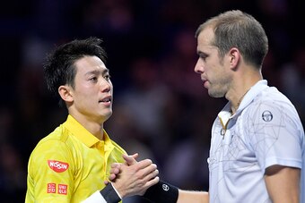 BASEL, SWITZERLAND - OCTOBER 29:  Kei Nishikori of Japan shakes hands with Gilles Muller of Luxembourg following the Swiss Indoors ATP 500 tennis tournament semi-final match at St Jakobshalle on October 29, 2016 in Basel, Switzerland.  (Photo by Harold Cu