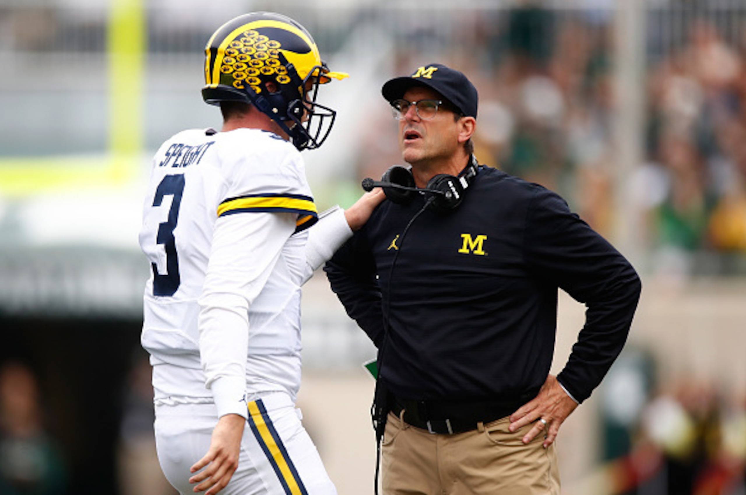 EAST LANSING, MI - OCTOBER 29: Head coach Jim Harbaugh of the Michigan State Spartans talks with Wilton Speight #3 while playing the Michigan State Spartans at Spartan Stadium on October 29, 2016 in East Lansing, Michigan. (Photo by Gregory Shamus/Getty I