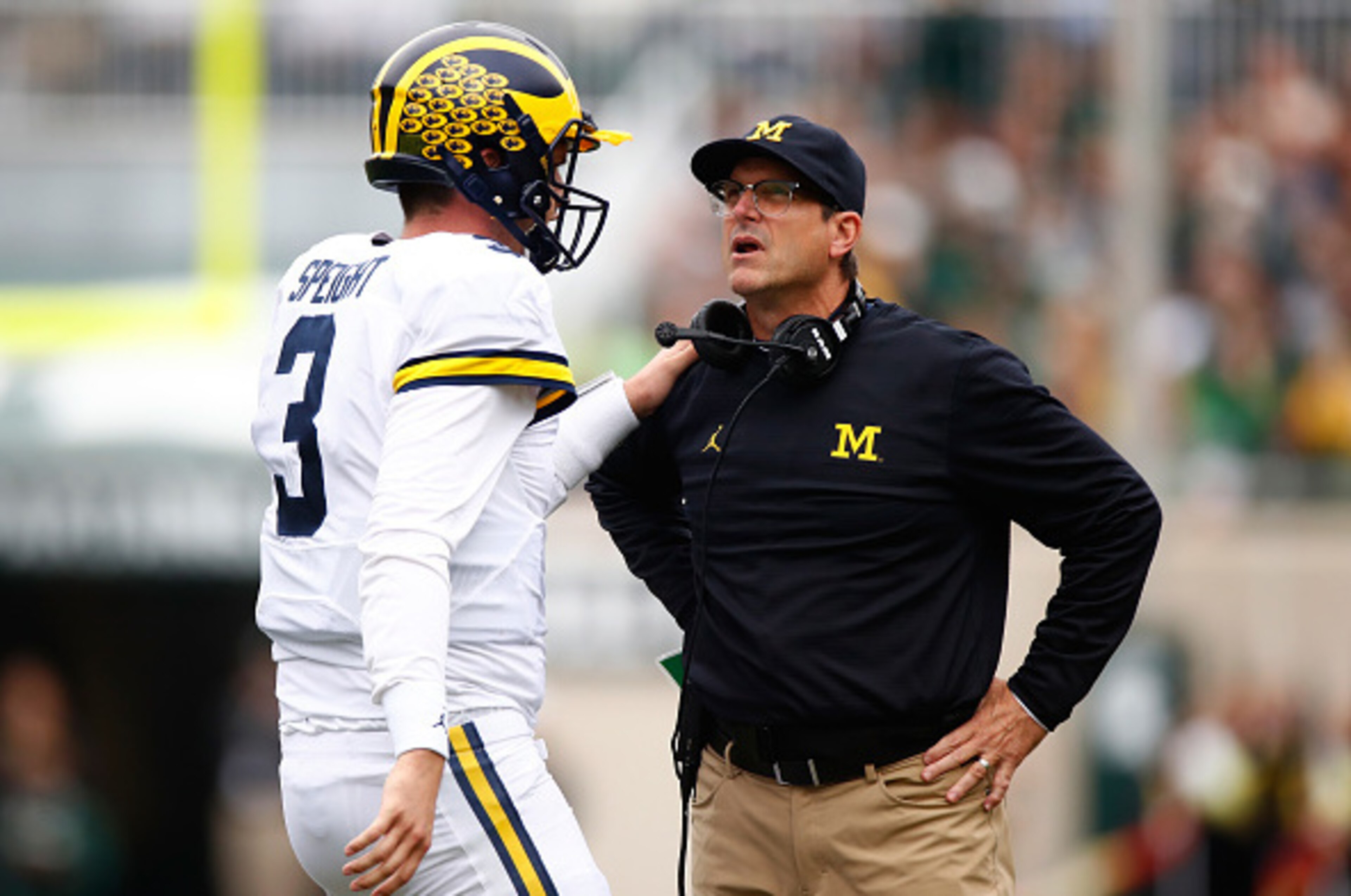 EAST LANSING, MI - OCTOBER 29: Head coach Jim Harbaugh of the Michigan State Spartans talks with Wilton Speight #3 while playing the Michigan State Spartans at Spartan Stadium on October 29, 2016 in East Lansing, Michigan. (Photo by Gregory Shamus/Getty I EAST LANSING, MI - OCTOBER 29: Head coach Jim Harbaugh of the Michigan State Spartans talks with Wilton Speight #3 while playing the Michigan State Spartans at Spartan Stadium on October 29, 2016 in East Lansing, Michigan. (Photo by Gregory Shamus/Getty I