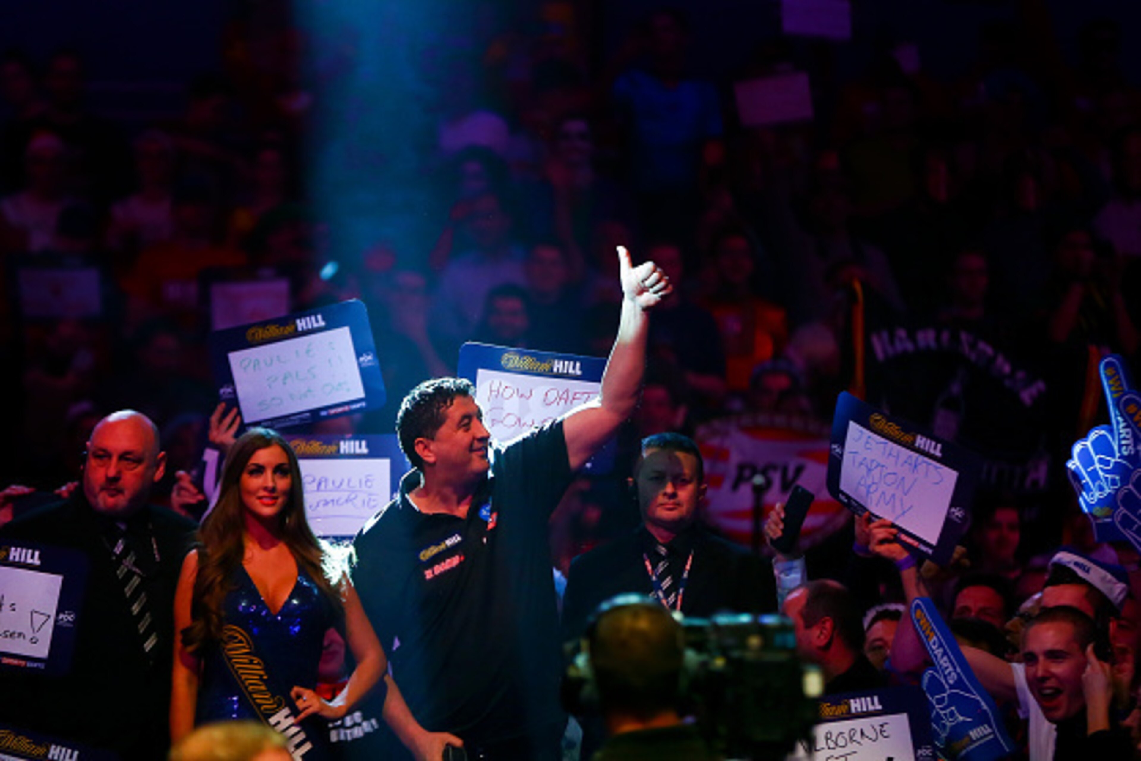 LONDON, ENGLAND - DECEMBER 29: Mensur Suljovic of Austria walks on ahead of his third round match against Adrian Lewis of England on Day Eleven of the 2016 William Hill PDC World Darts Championships at Alexandra Palace on December 29, 2015 in London, Eng LONDON, ENGLAND - DECEMBER 29: Mensur Suljovic of Austria walks on ahead of his third round match against Adrian Lewis of England on Day Eleven of the 2016 William Hill PDC World Darts Championships at Alexandra Palace on December 29, 2015 in London, Eng