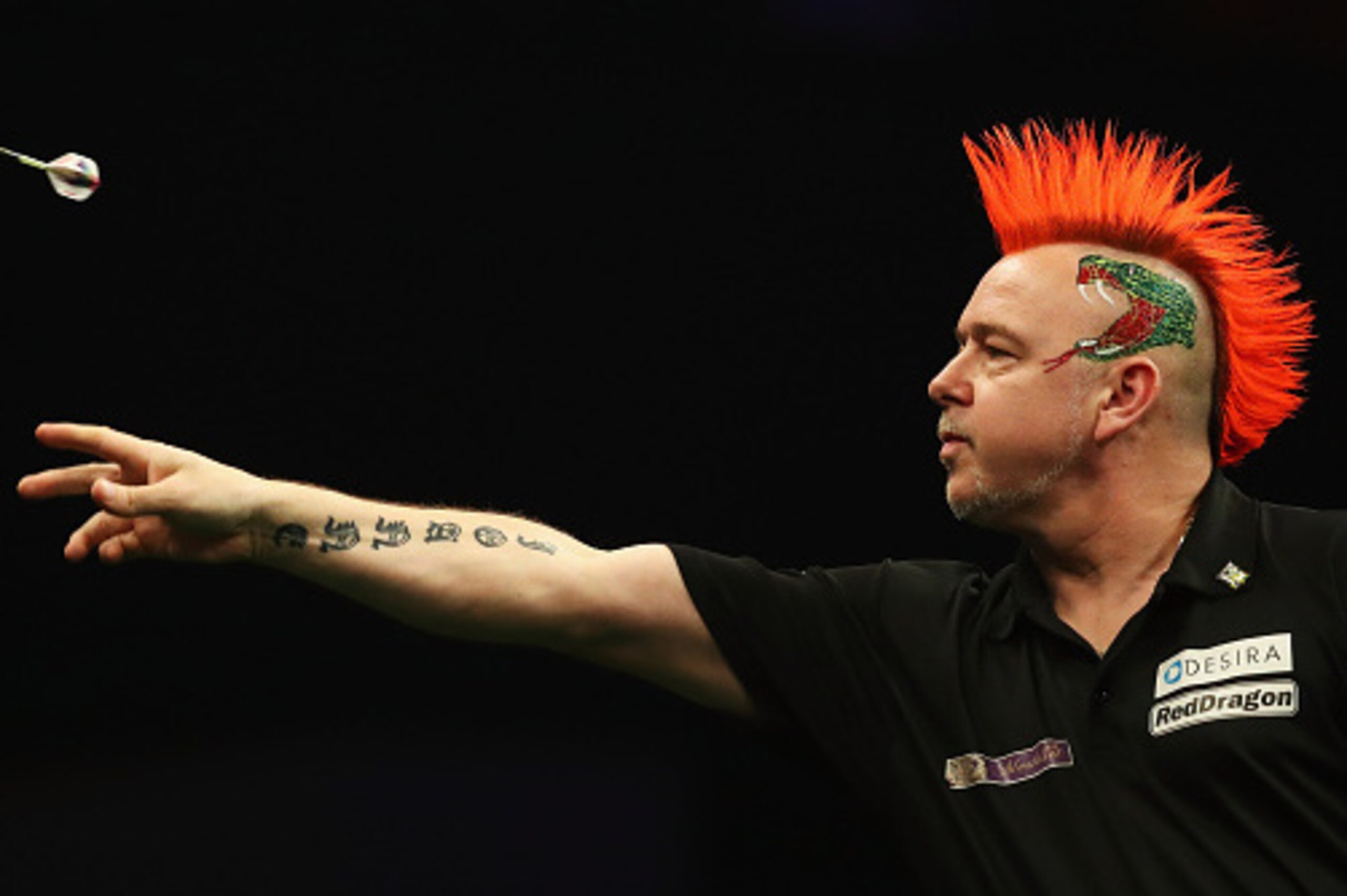 ROTTERDAM, NETHERLANDS - MAY 12:  Peter Wright of Scotland plays a shot in his match against Raymond van Barneveld of the Netherlands during the Darts Betway Premier League Night 15 at Rotterdam Ahoy on May 12, 2016 in Rotterdam, .  (Photo by Dean Mouhtar