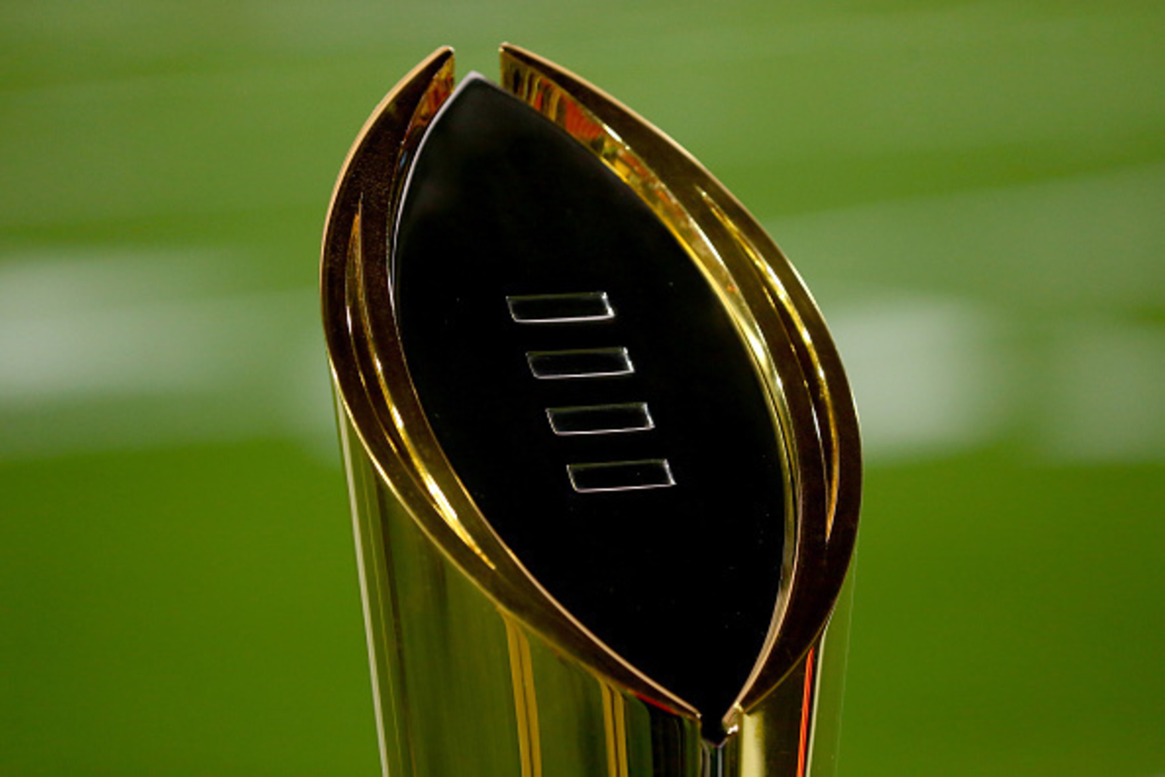GLENDALE, AZ - JANUARY 11: The College Football Playoff National Championship Trophy is seen on the field before the 2016 College Football Playoff National Championship Game between the Clemson Tigers and the Alabama Crimson Tide at University of Phoenix GLENDALE, AZ - JANUARY 11: The College Football Playoff National Championship Trophy is seen on the field before the 2016 College Football Playoff National Championship Game between the Clemson Tigers and the Alabama Crimson Tide at University of Phoenix