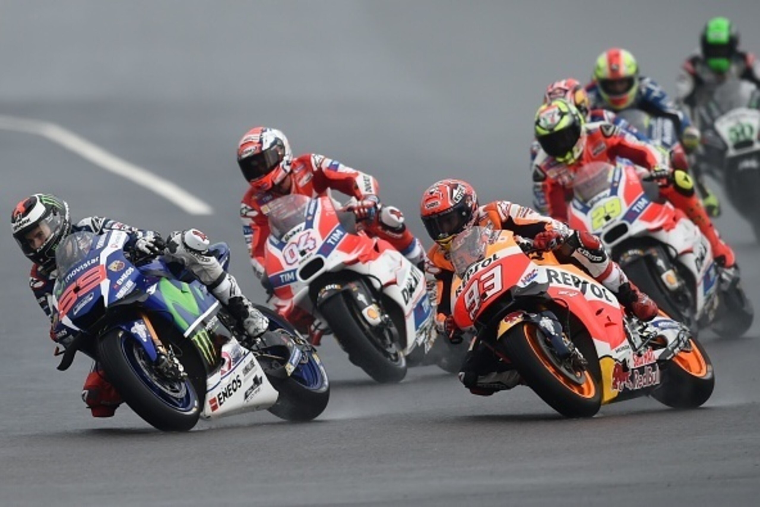Movistar Yamaha MotoGP's Spanish rider Jorge Lorenzo (L) leads Ducati Team's Italian rider Andrea Dovizioso (2nd L) and Repsol Honda Team's Spanish rider Marc Marquez (3rd L) during the Malaysian MotoGP race at the Sepang International circuit on October 