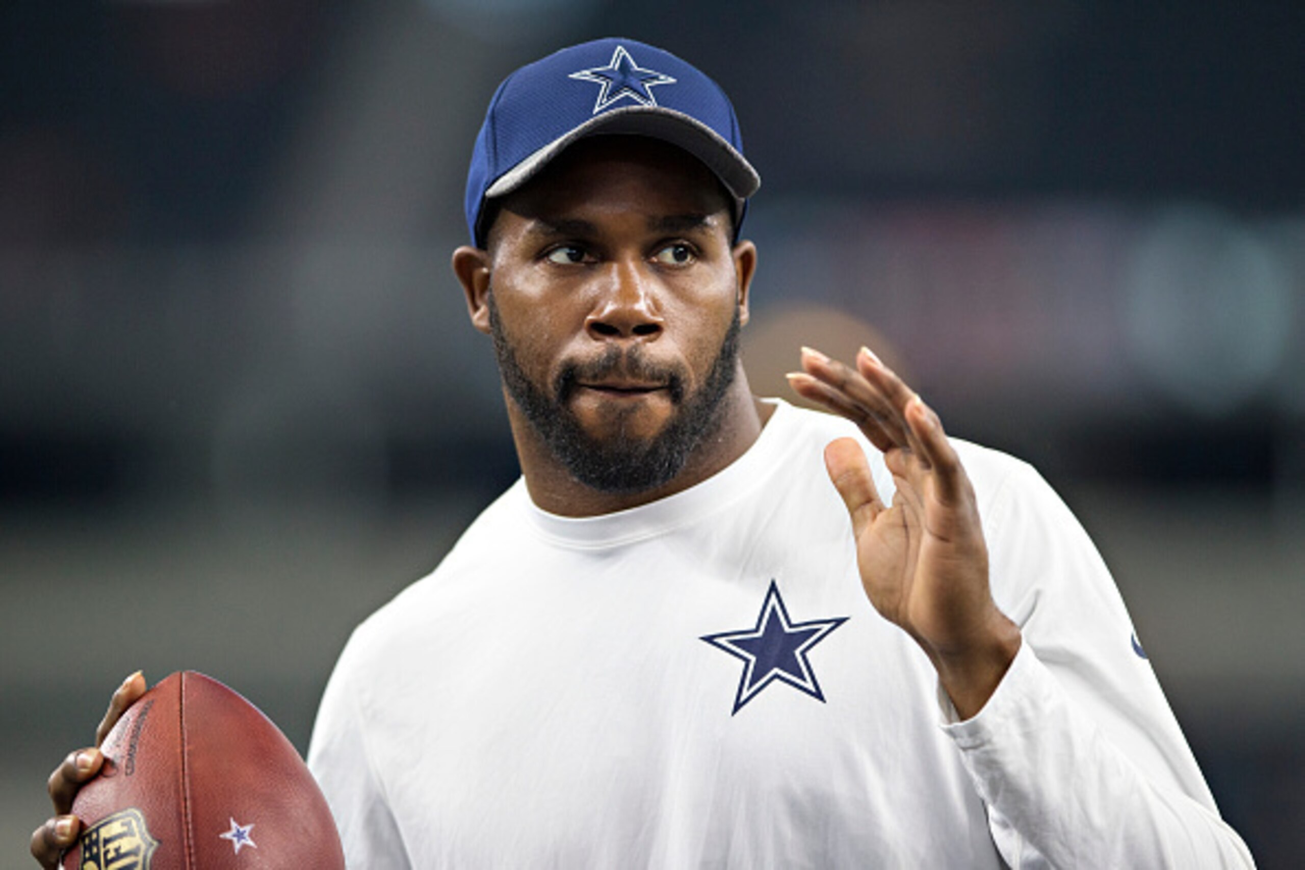 ARLINGTON, TX - SEPTEMBER 1:  Darren McFadden #20 of the Dallas Cowboys who is not dressed out helps the team warm up before a preseason game against the Houston Texans at AT&T Stadium on September 1, 2016 in Arlington, Texas.  The Texans defeated the Cow
