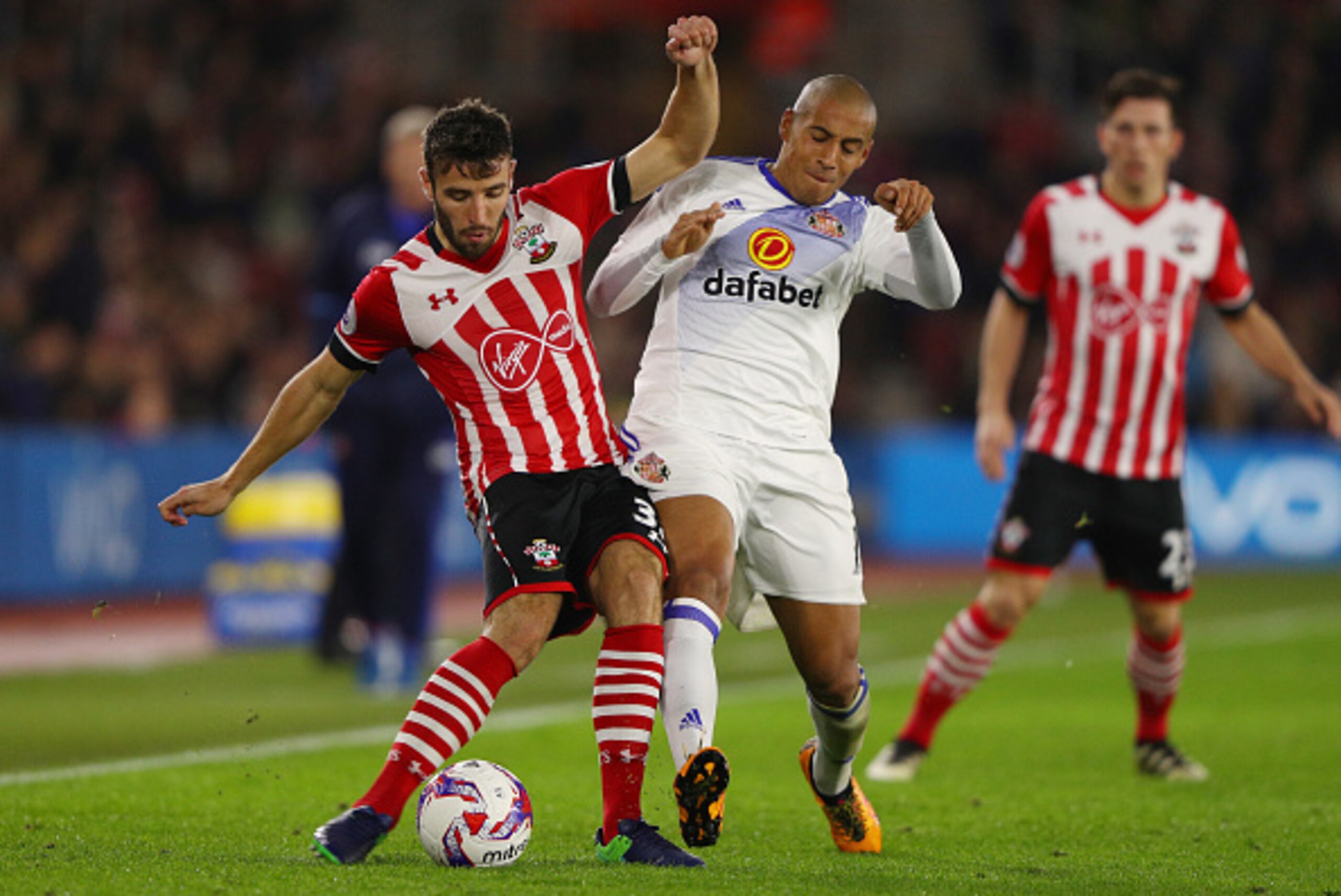 SOUTHAMPTON, ENGLAND - OCTOBER 26: Sam McQueen of Southampton (L) and Wahbi Khazri of Sunderland (R) battle for possession during the EFL Cup fourth round match between Southampton and Sunderland at St Mary's Stadium on October 26, 2016 in Southampton, En